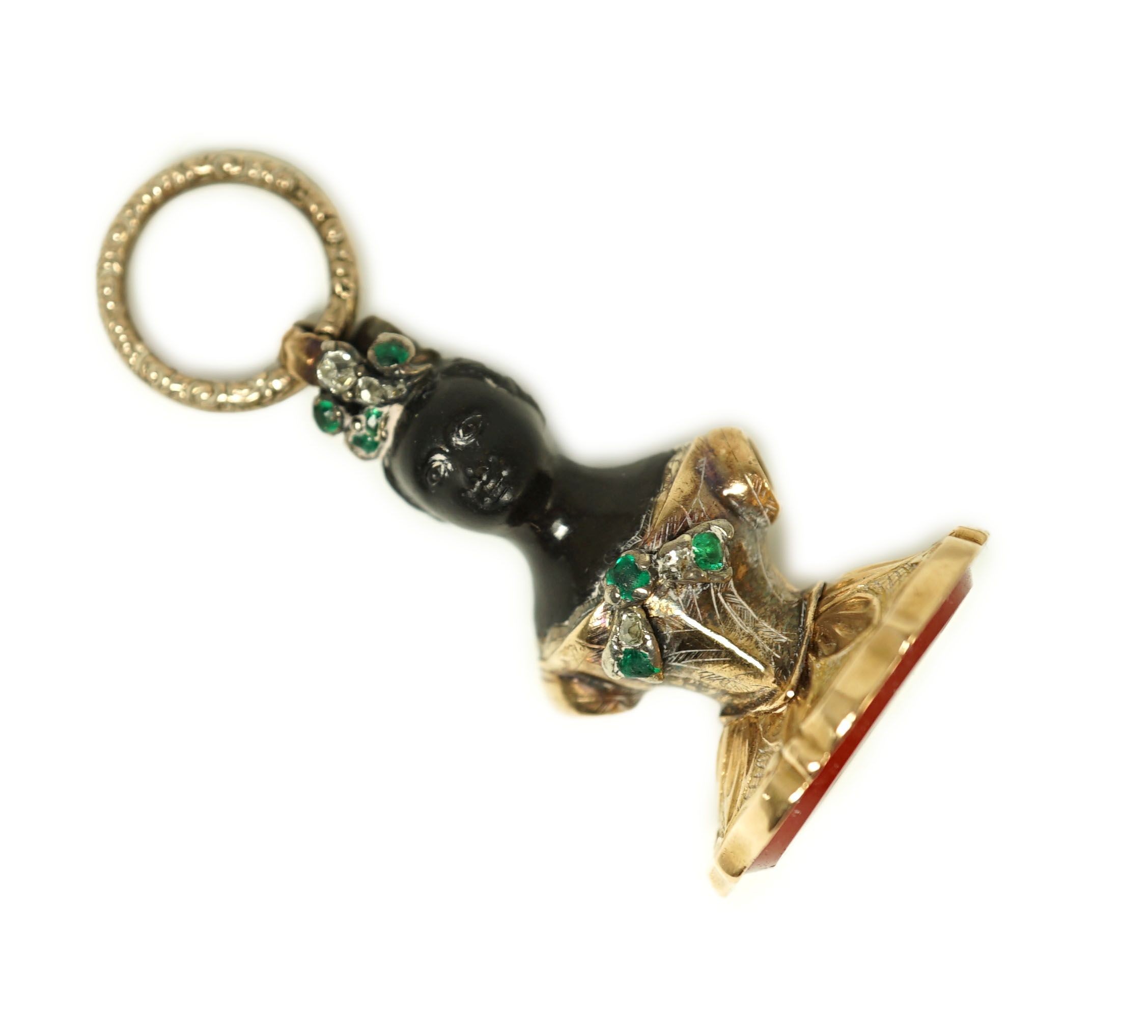 A 19th century gold overlaid, emerald and diamond set double sided Blackamoor seal pendant